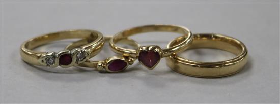 Three 9ct gold and gem set rings and a 9ct gold band.